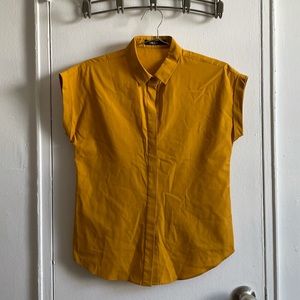 Mustard/turmeric top with hidden buttons